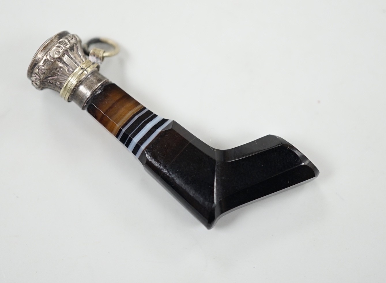A 19th century white metal and bloodstone set novelty seal, modelled as a revolver, with banded agate handle, 43mm.